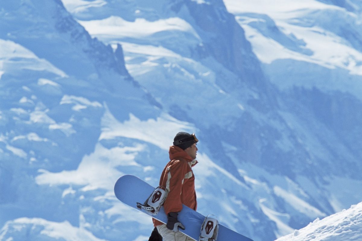 Young man snowboarding